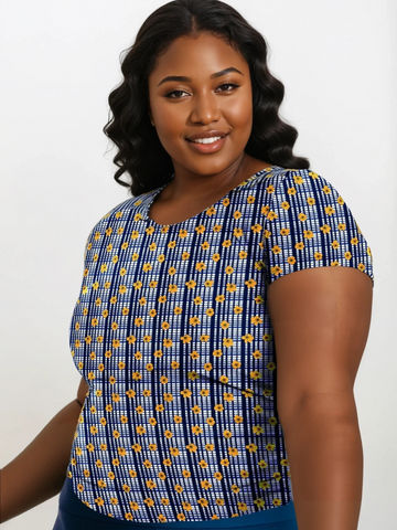 Woman wearing a blue and yellow patterned top on a white background