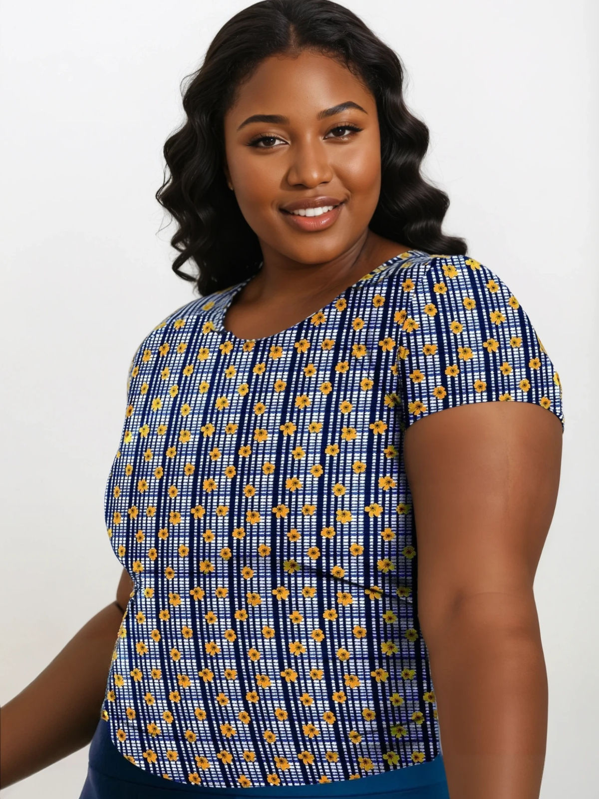 Woman wearing a blue and yellow patterned top on a white background