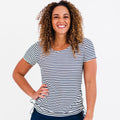 Short Sleeve Adele Swim Top in navy and white stripes modeled by a smiling woman showcasing supportive comfortable size inclusive swimwear designed for every body