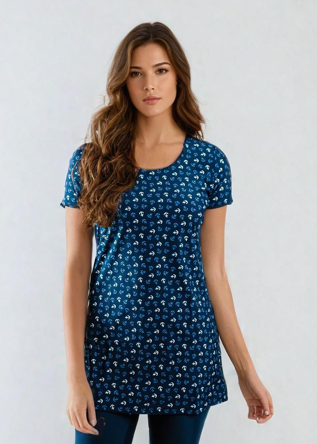Woman wearing a blue patterned dress against a white background