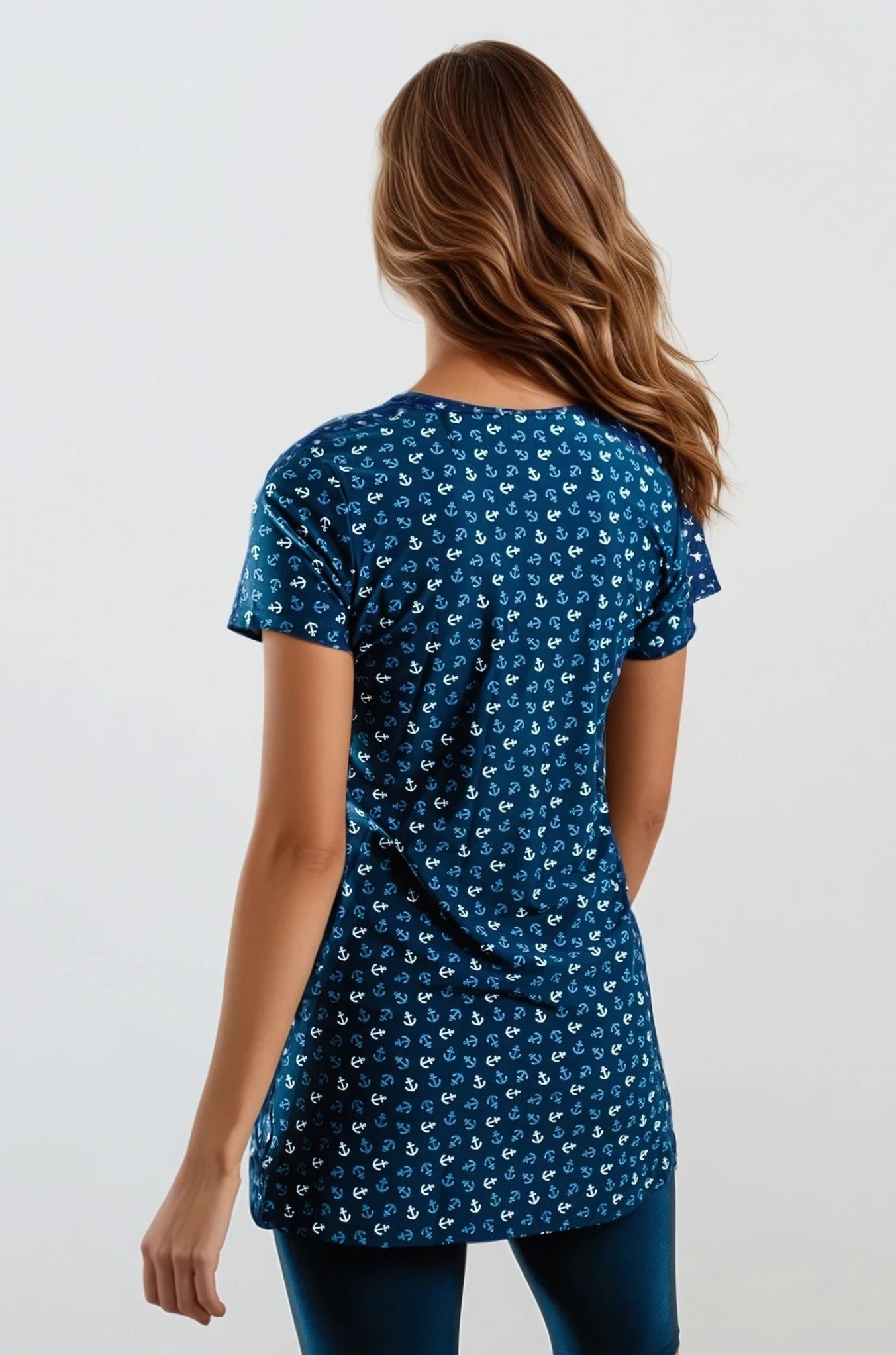 Woman wearing a blue patterned t-shirt on a white background