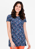 Woman wearing a blue floral dress on a white background