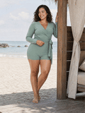 Avery 2 Piece Swim Set – Wrap Long Sleeve Top & Shorts | Plus Size shown on a woman at the beach as modest supportive size-inclusive swimwear designed for every body