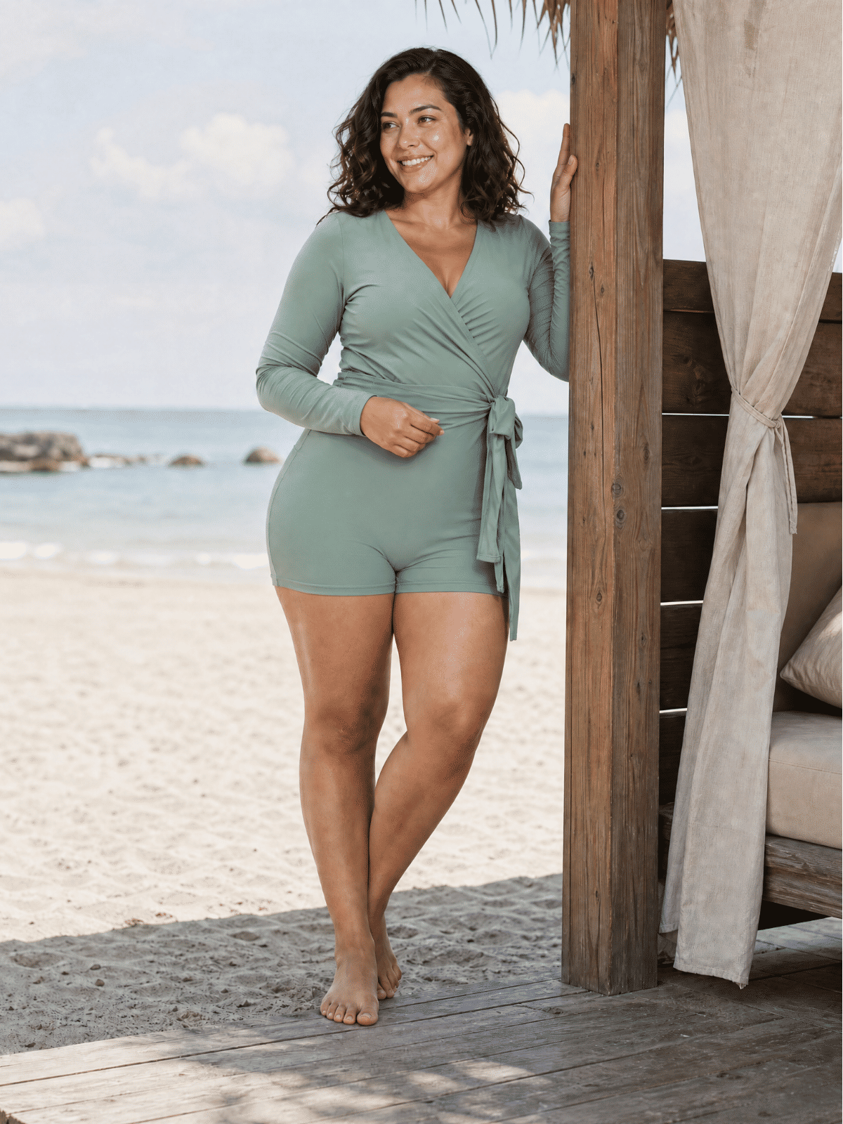 Avery 2 Piece Swim Set – Wrap Long Sleeve Top & Shorts | Plus Size shown on a woman at the beach as modest supportive size-inclusive swimwear designed for every body