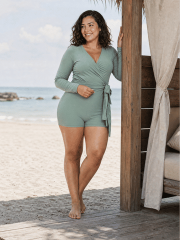 Avery 2 Piece Swim Set – Wrap Long Sleeve Top & Shorts | Plus Size shown on a woman at the beach as modest supportive size-inclusive swimwear designed for every body