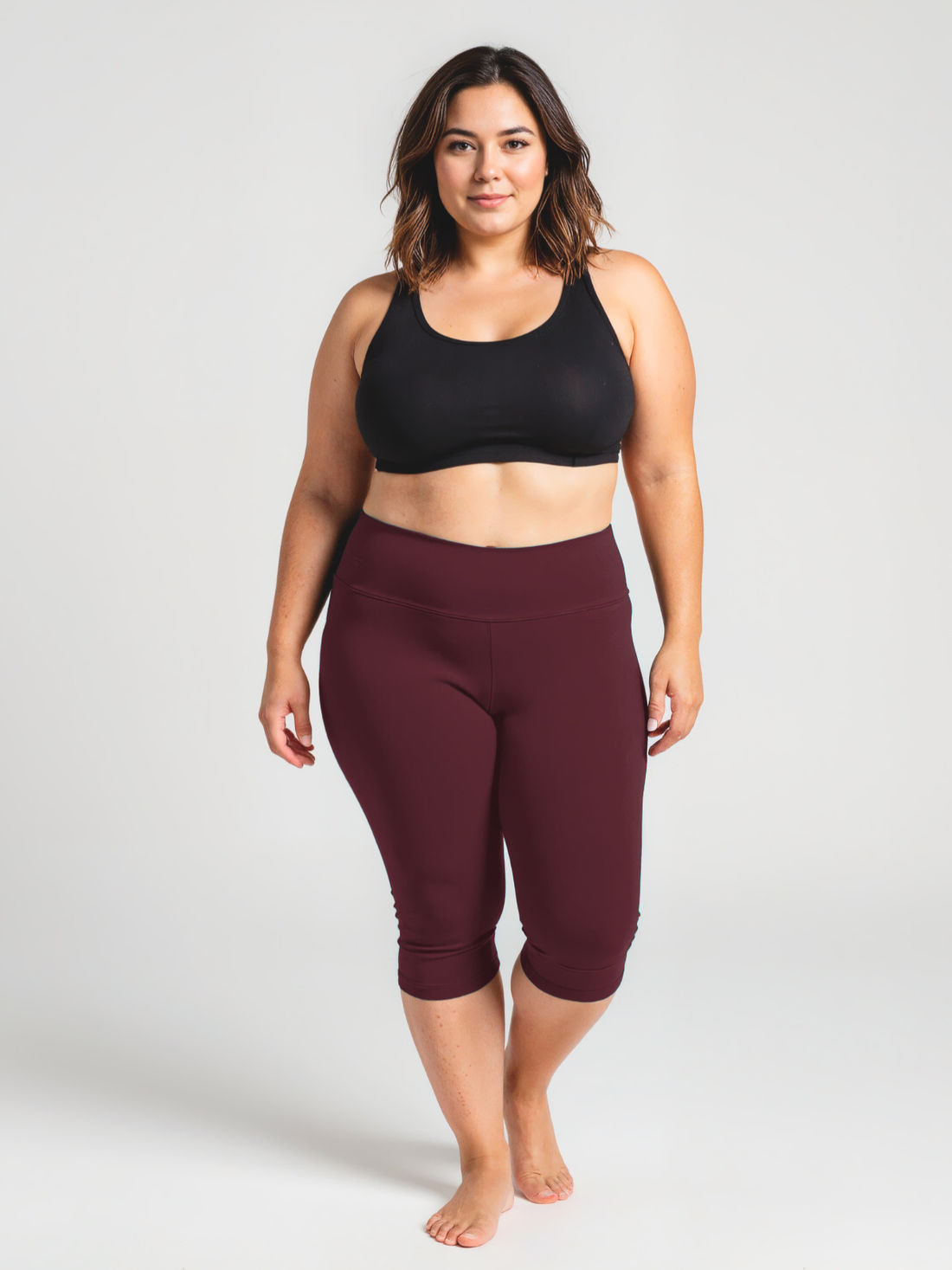 Capri Swim Leggings | Plus Size model wearing supportive swim leggings at the beach with a comfortable fit in modest size inclusive swimwear for every body
