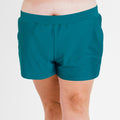 Front view of plus size swim shorts in dark jade color featuring an elastic waistband for a comfortable fit, part of Classic Fit Swim Shorts With Panty | Final Sale collection, size-inclusive and supportive swimwear designed for every body.
