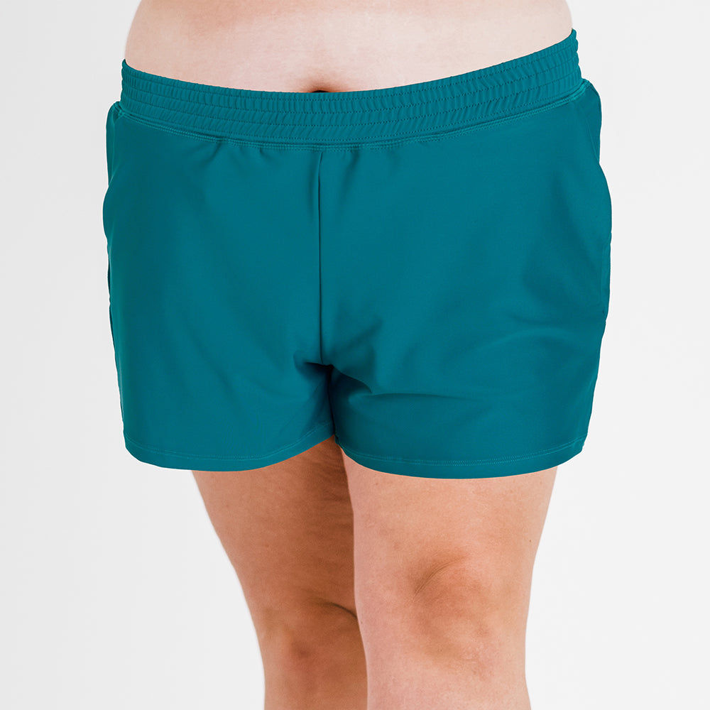 Front view of plus size swim shorts in dark jade color featuring an elastic waistband for a comfortable fit, part of Classic Fit Swim Shorts With Panty | Final Sale collection, size-inclusive and supportive swimwear designed for every body.