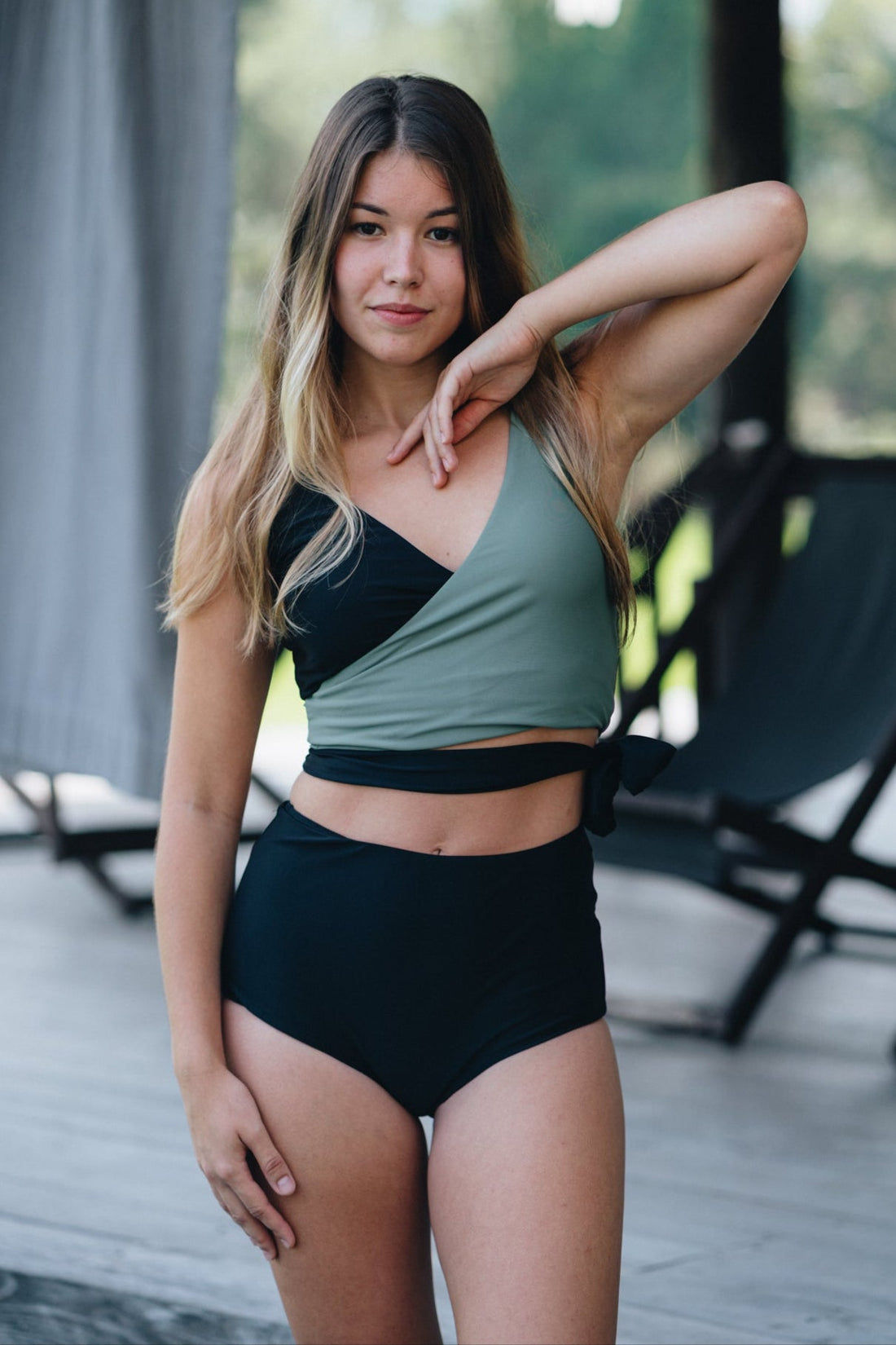 Woman wearing a two-tone bikini with a white background