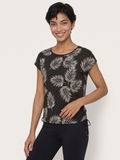 Daphne Loose Fit Swim Top in black with white palm leaf print and side drawstring modeled with black swim leggings for comfortable modest swimwear for every body