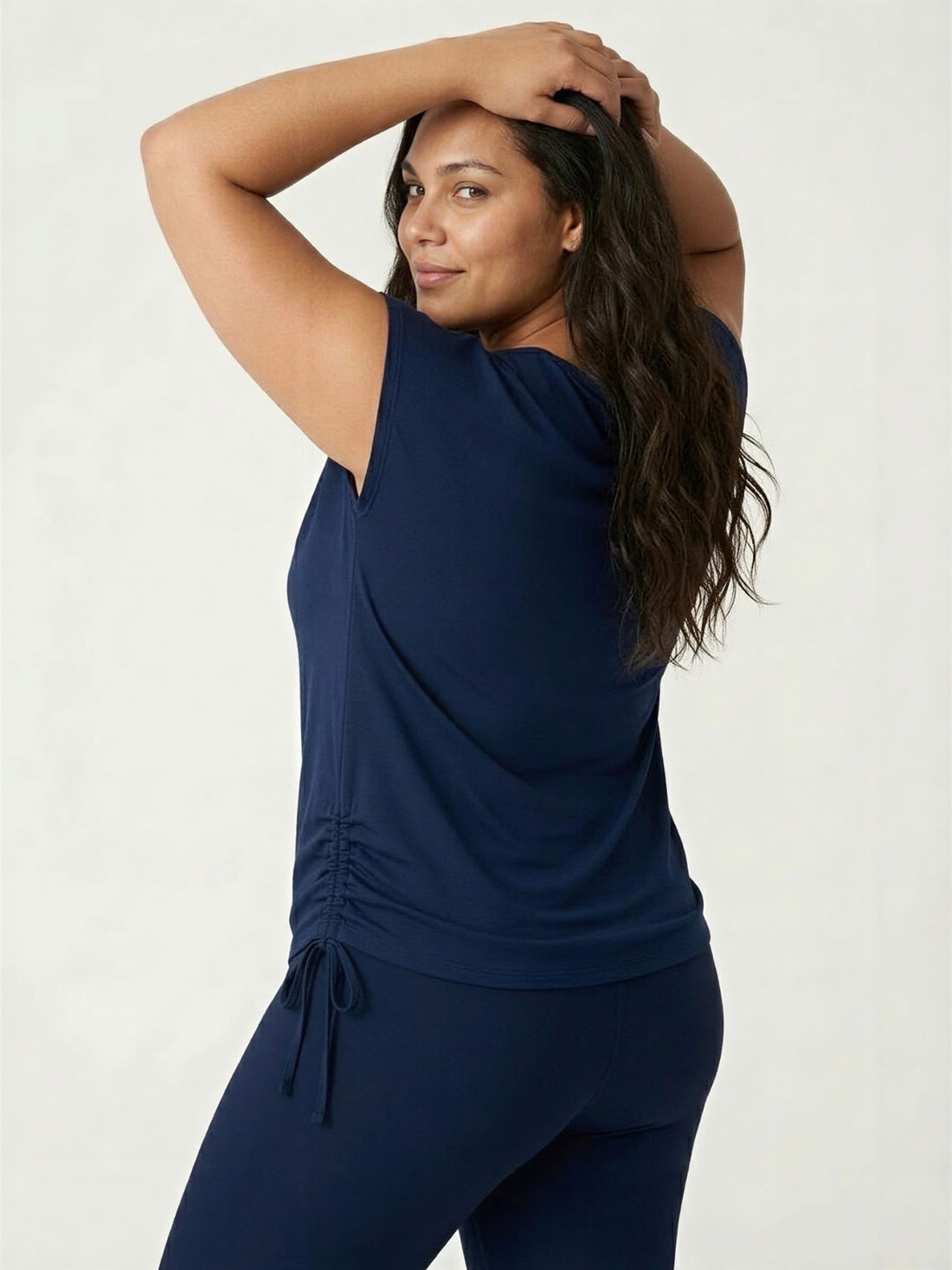 Daphne Loose Fit Swim Top | Plus Size in navy shown from the back with ruched sides for a comfortable fit and modest size inclusive swimwear for every body