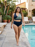 Emery 2 Piece Swim Set - Wrap Swim Top & Bikini Bottom | Plus Size, modeled in navy and sage by a woman beside a pool for supportive, comfortable swimwear