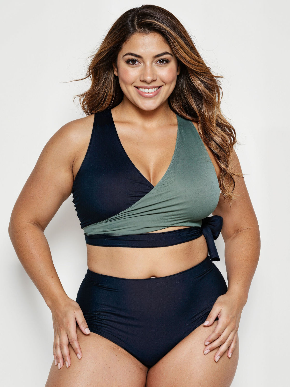Woman wearing a two-tone bikini with a white background