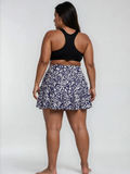 Flowy Swim Skort With Shorts | Plus Size in navy floral print with black swim top for modest supportive swimwear and a comfortable fit