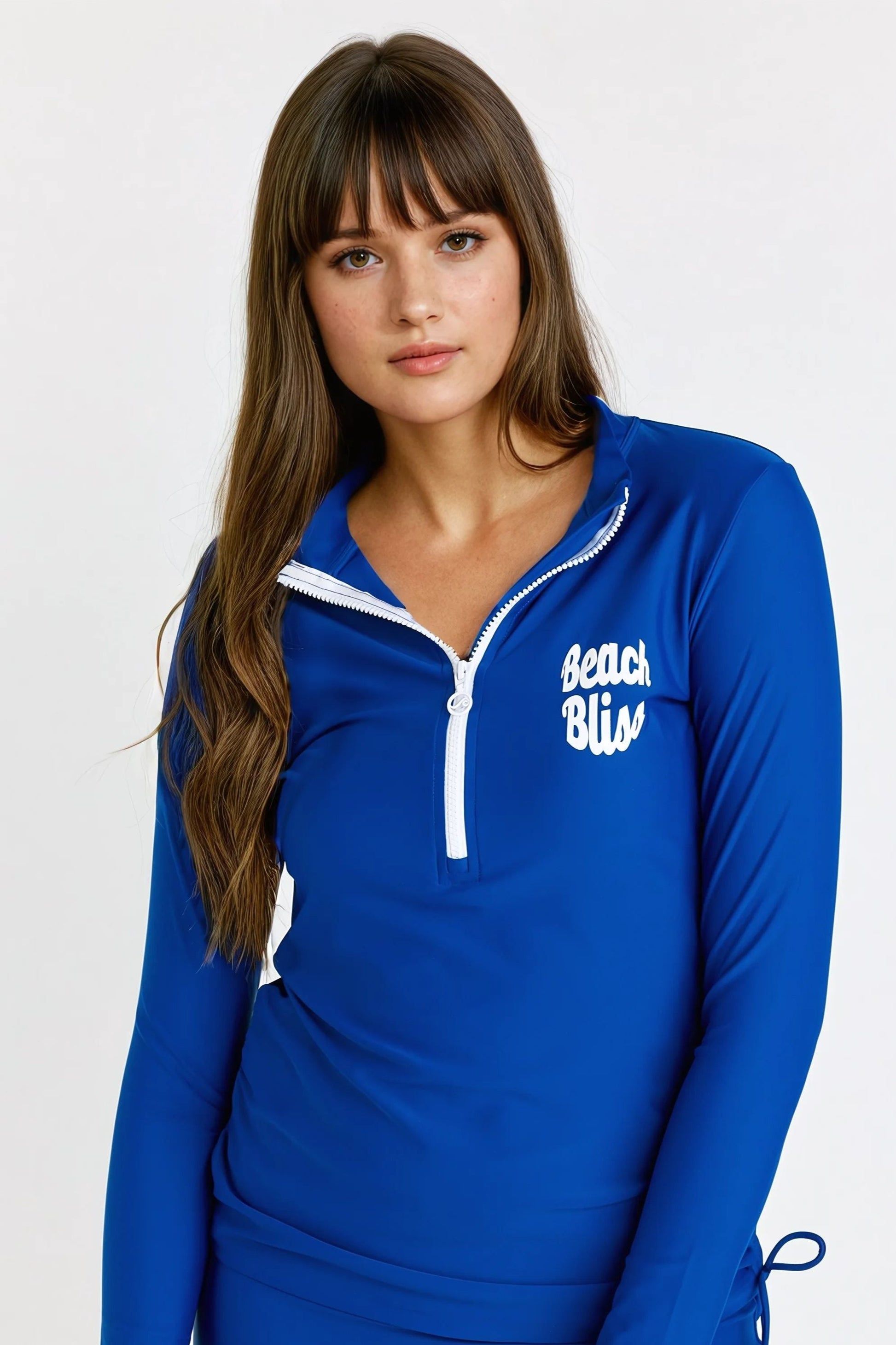 Woman wearing a blue long-sleeve top with 'Beach Bliss' text on a white background