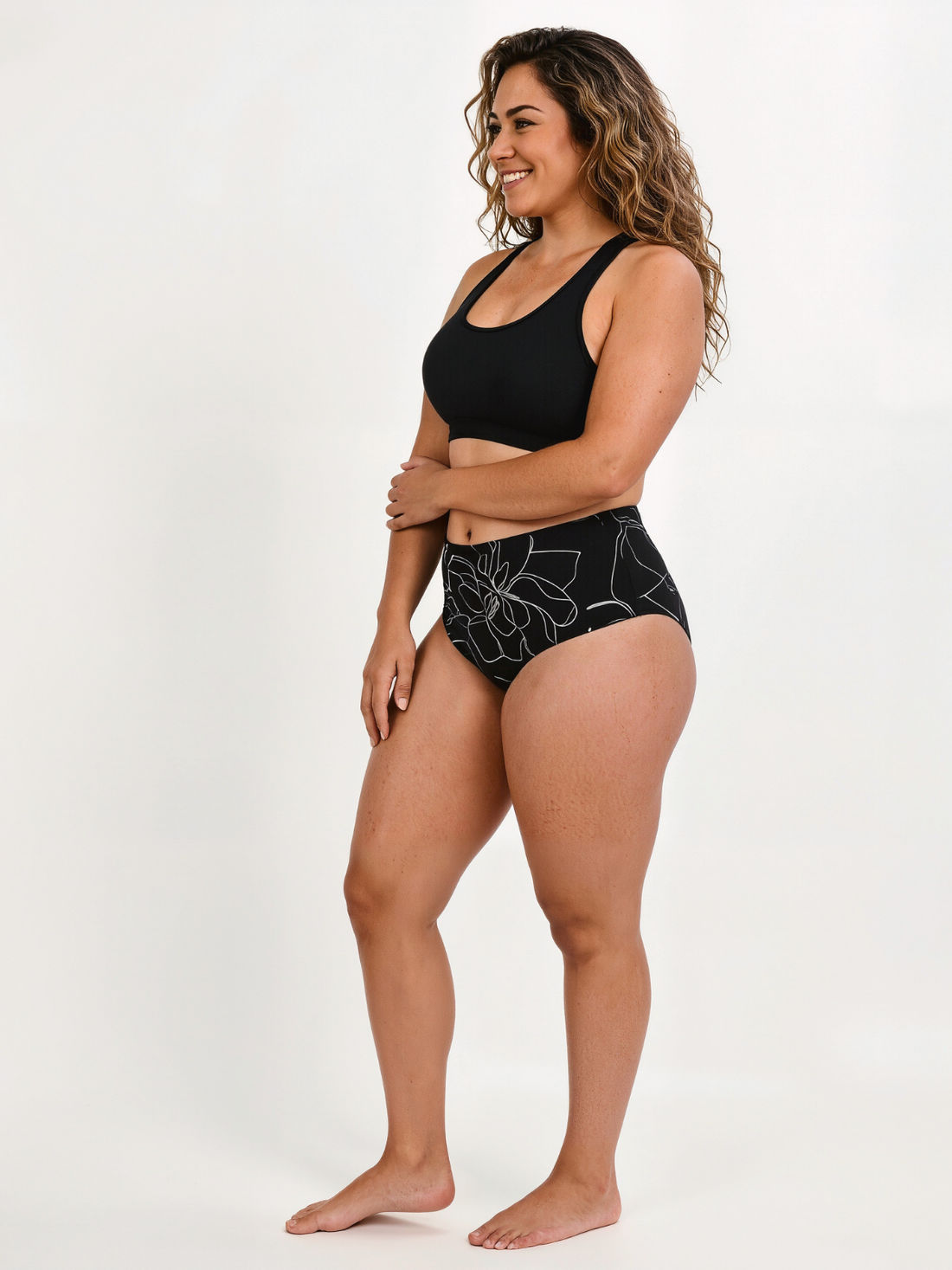 High Waisted Full Coverage Bikini Bottom | Plus Size worn by a woman walking through shallow beach water in supportive size-inclusive swimwear designed for every body