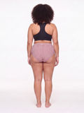 Rear view of a model wearing the High Waisted Full Coverage Bikini Bottom | Plus Size, featuring striped fabric, a high rise, and full coverage for a comfortable fit.
