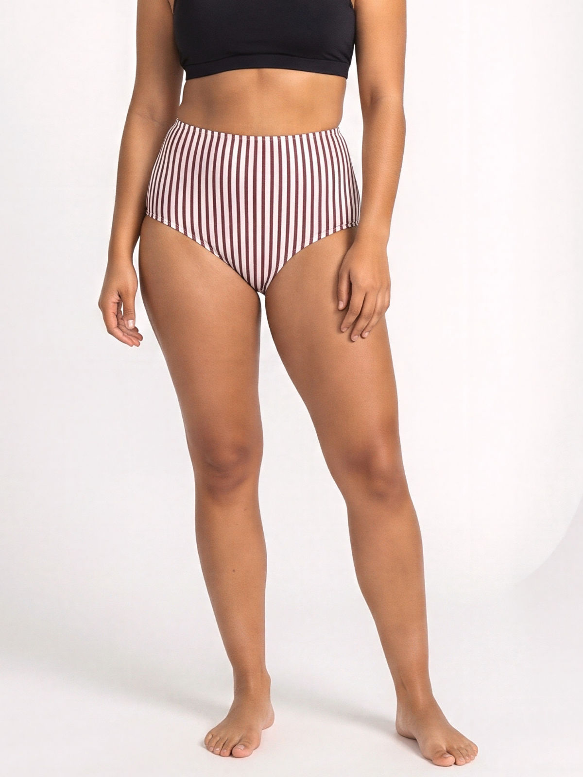 High Waisted Full Coverage Bikini Bottom in a red and white vertical stripe print modeled for a supportive comfortable fit and swimwear designed for every body