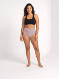 High Waisted Full Coverage Bikini Bottom with striped fabric on a smiling model size inclusive supportive swimwear designed for every body