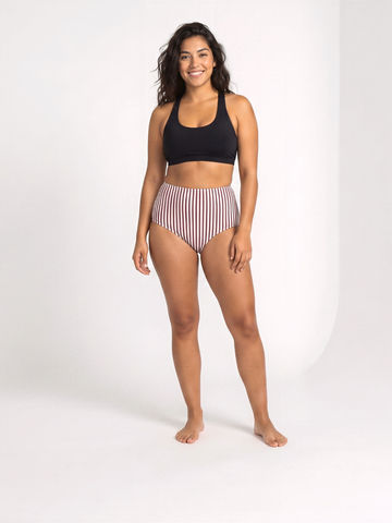 High Waisted Full Coverage Bikini Bottom with striped fabric on a smiling model size inclusive supportive swimwear designed for every body