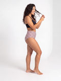 Model wearing High Waisted Full Coverage Bikini Bottom with vertical stripes showcasing supportive swimwear and a comfortable fit for every body