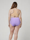 High Waisted Bikini Bottom With Front Tie | Last Call shown from the back in lavender on a model with a supportive and comfortable fit for every body