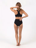 High Waisted Full Coverage Bikini Bottom in black shown from behind on a model with modest coverage and a supportive comfortable fit for every body