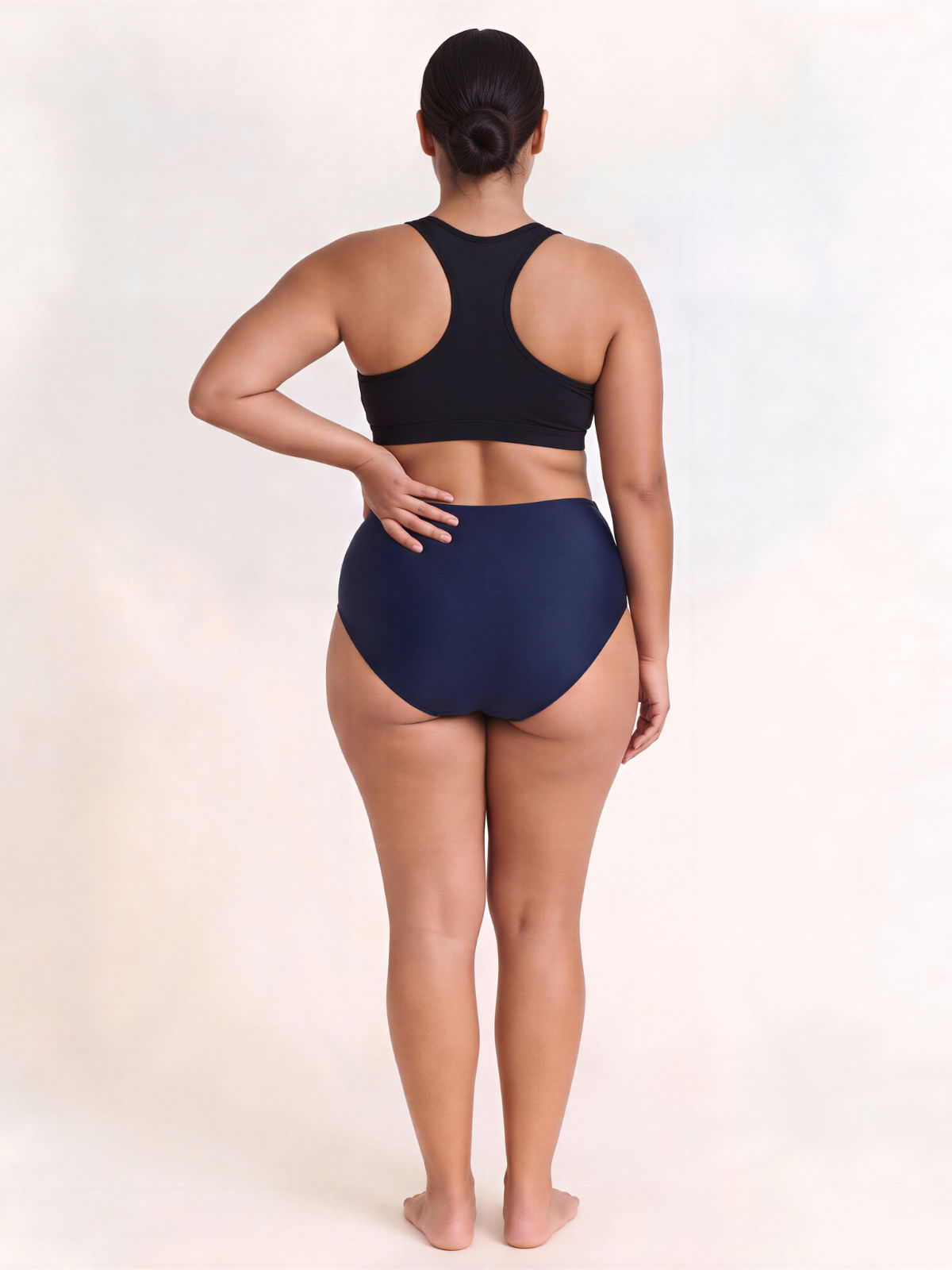 High Waisted Full Coverage Bikini Bottom | Plus Size shown from the back on a model with a black swim top for supportive comfortable fit and modest size-inclusive swimwear