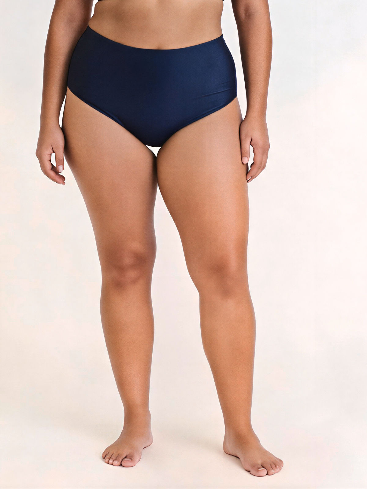 High Waisted Full Coverage Bikini Bottom | Plus Size in navy on a model showcasing a high rise modest coverage supportive fit and swimwear designed for every body