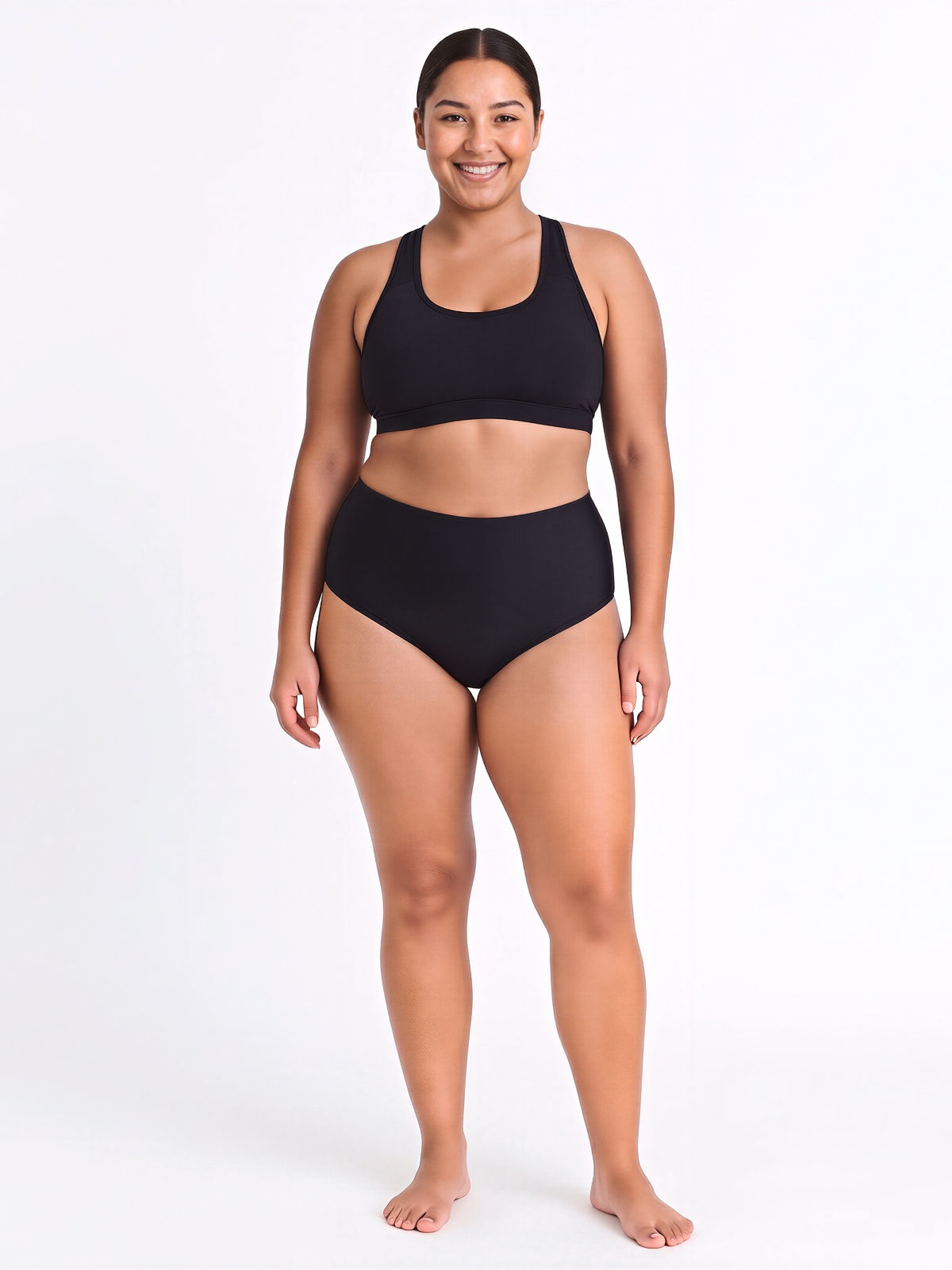 Model wearing the High Waisted Full Coverage Bikini Bottom | Plus Size in black, showing a high rise, full coverage fit and supportive swimwear designed for every body