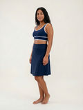 Woman wearing a navy Knee Length Swim Skort With Bike Shorts and supportive swimwear for a comfortable fit modest style and swimwear designed for every body