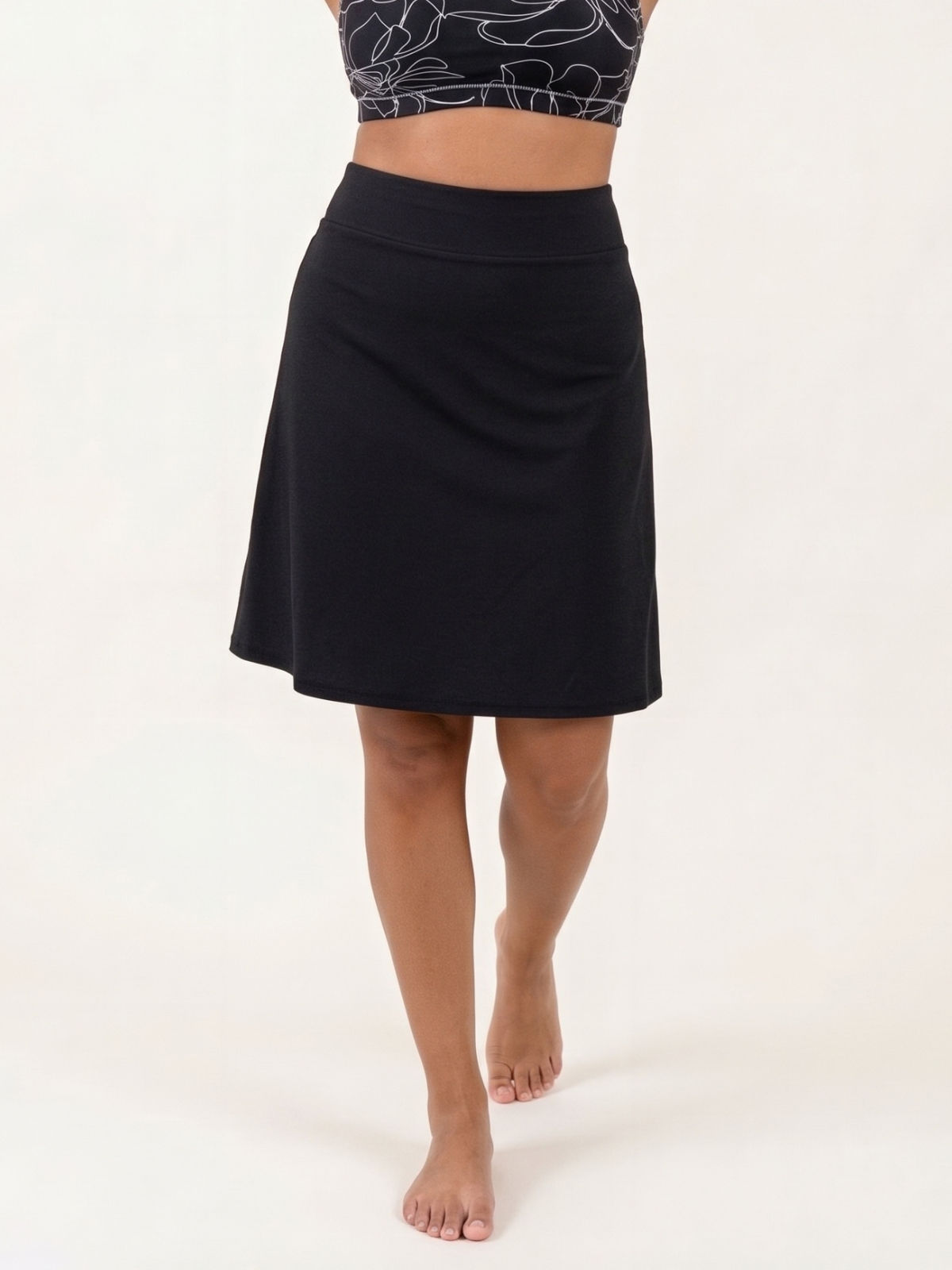 Knee Length Swim Skort With Bike Shorts in black offers modest supportive swimwear and a comfortable fit designed for every body
