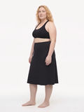 Black Long Swim Skort With Capri Leggings | Plus Size shown on a model with modest supportive swimwear and a comfortable fit designed for every body