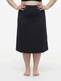 Long Swim Skort With Capri Leggings | Plus Size in black shown on a model as modest supportive swimwear designed for every body