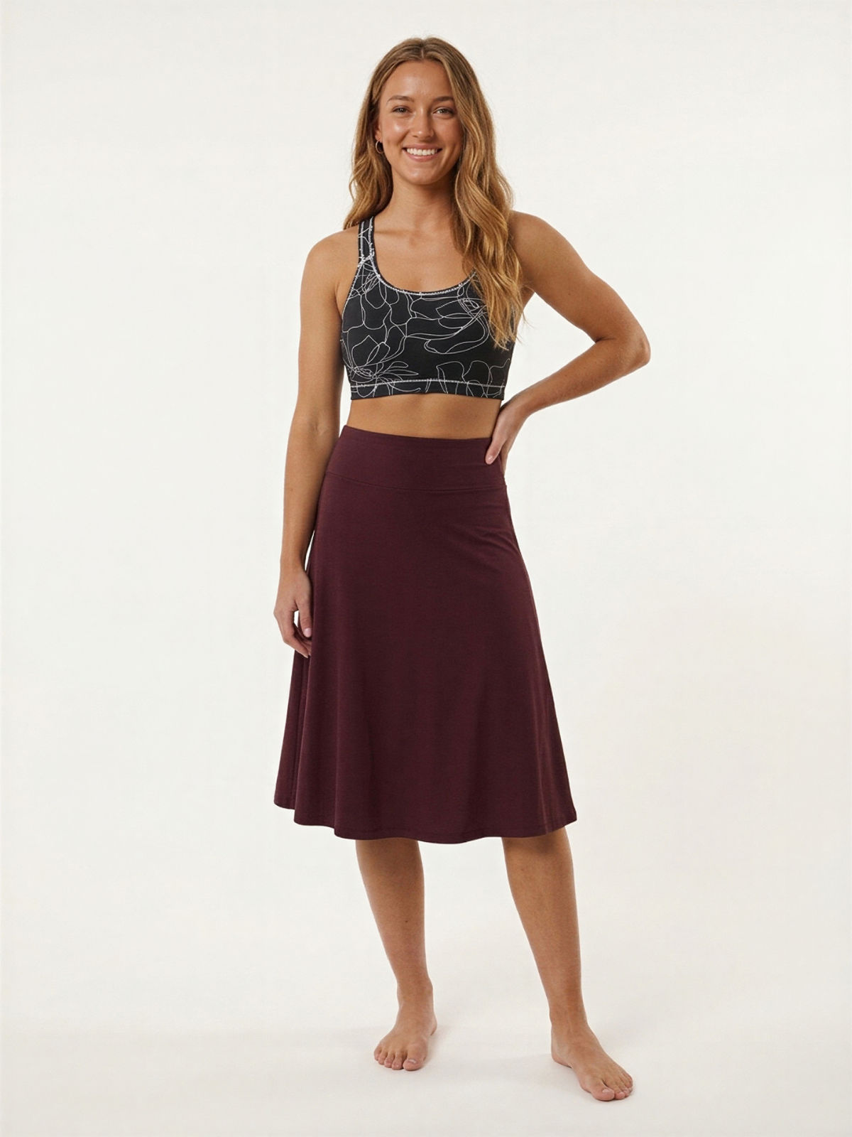 Long Swim Skort With Capri Leggings modeled by a smiling woman in a patterned swim top for modest supportive swimwear and a comfortable fit