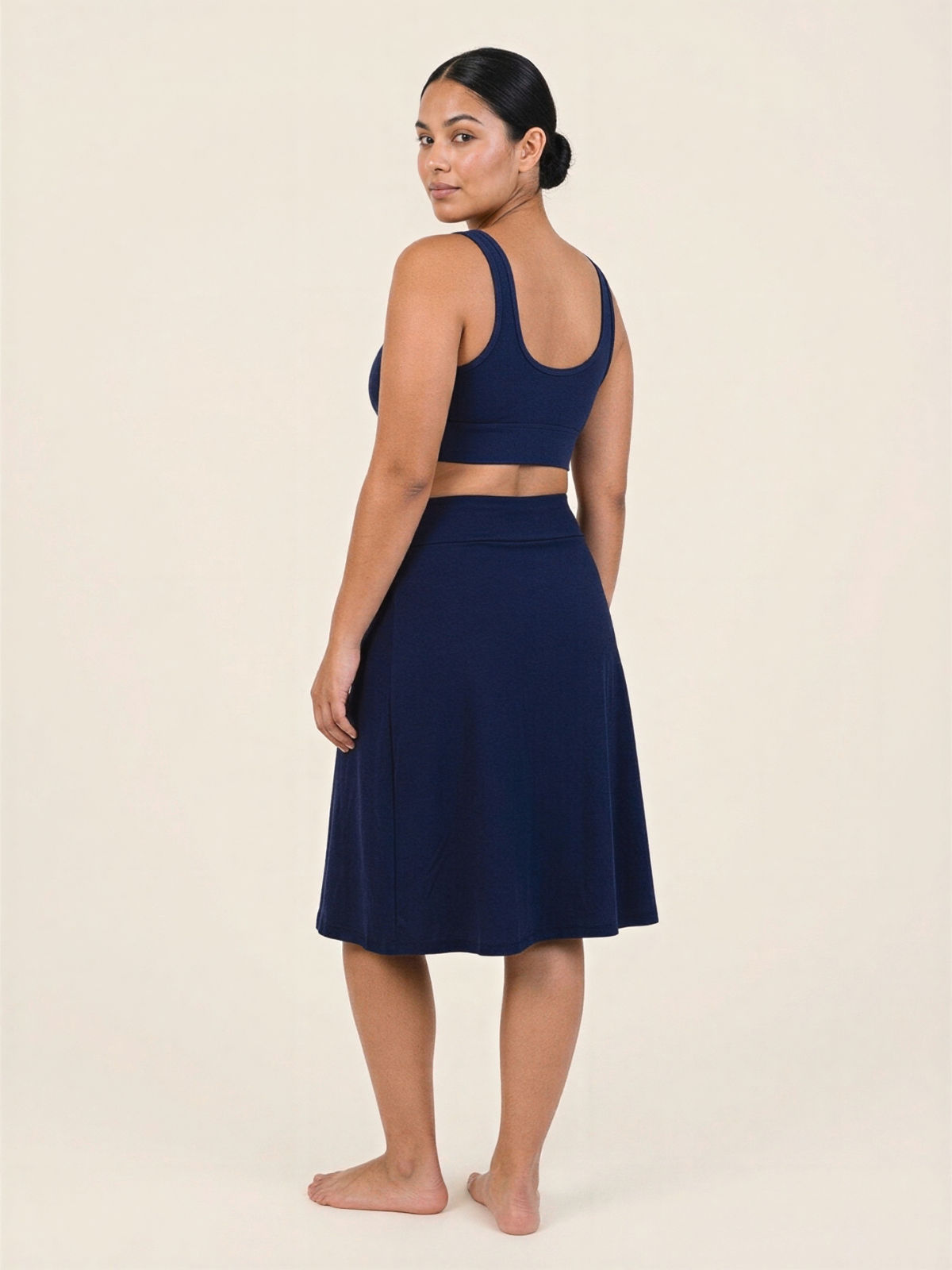 Long Swim Skort With Capri Leggings in navy shown from the back with a supportive swim top and comfortable modest fit for every body