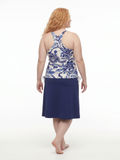 Back view of a woman wearing Long Swim Skort With Capri Leggings | Plus Size navy floral swimwear with a modest comfortable fit for every body