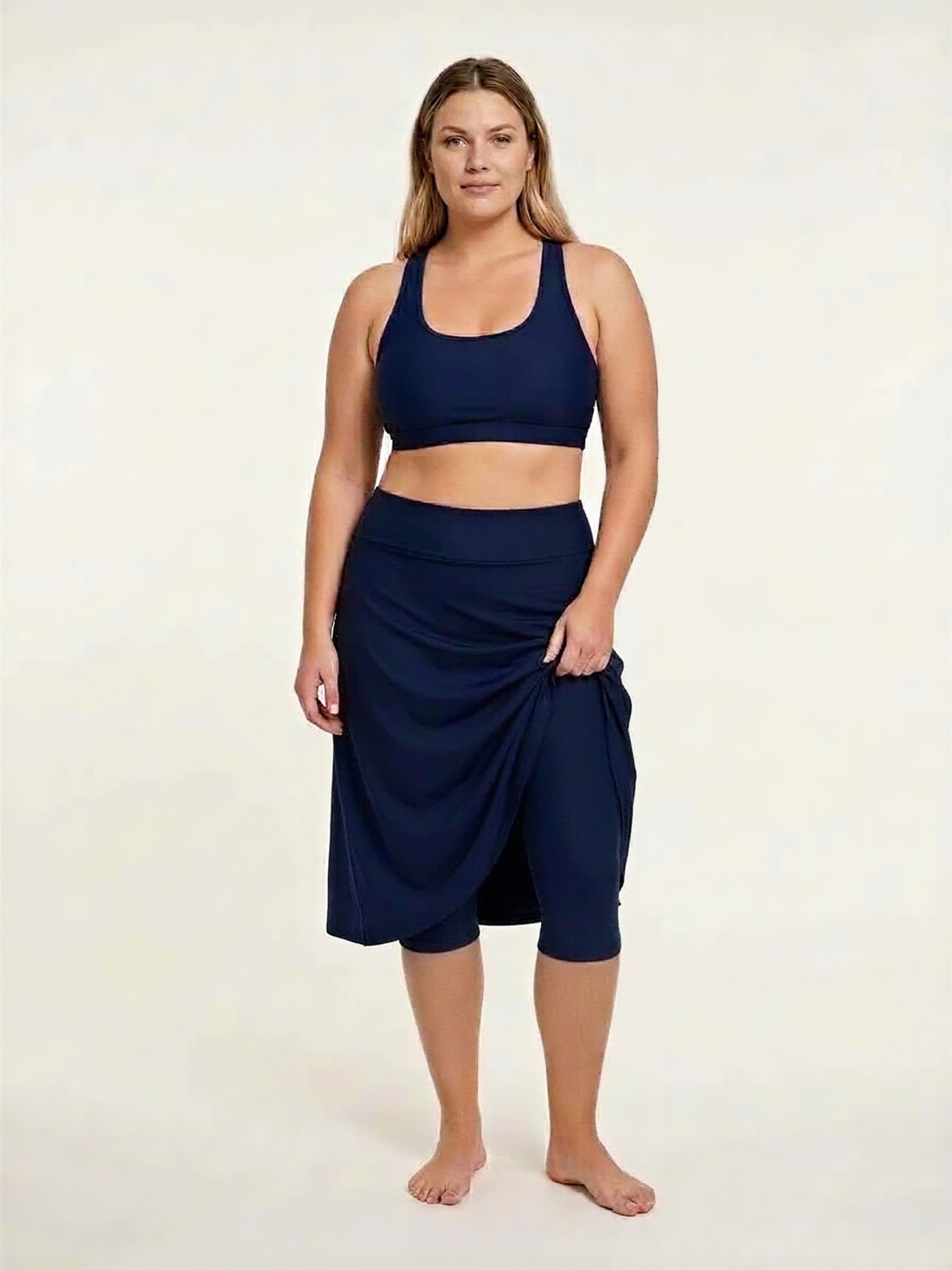 Black Long Swim Skort With Capri Leggings | Plus Size shown on a model with modest supportive swimwear and a comfortable fit designed for every body