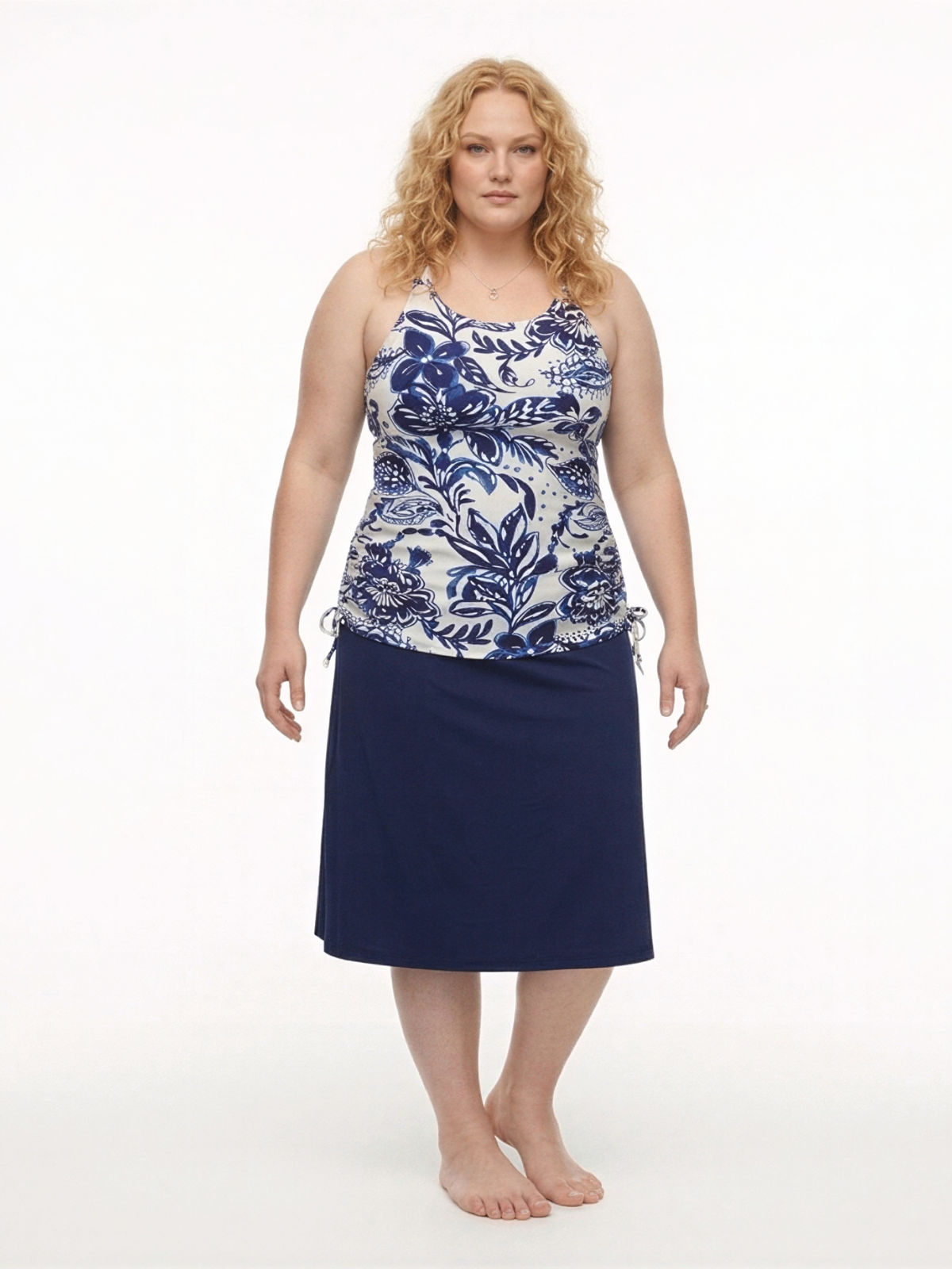 Long Swim Skort With Capri Leggings | Plus Size in navy with a floral swim top for modest supportive swimwear designed for every body