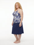 Model wearing Long Swim Skort With Capri Leggings | Plus Size in a navy and white floral design showcasing modest supportive size-inclusive swimwear for every body