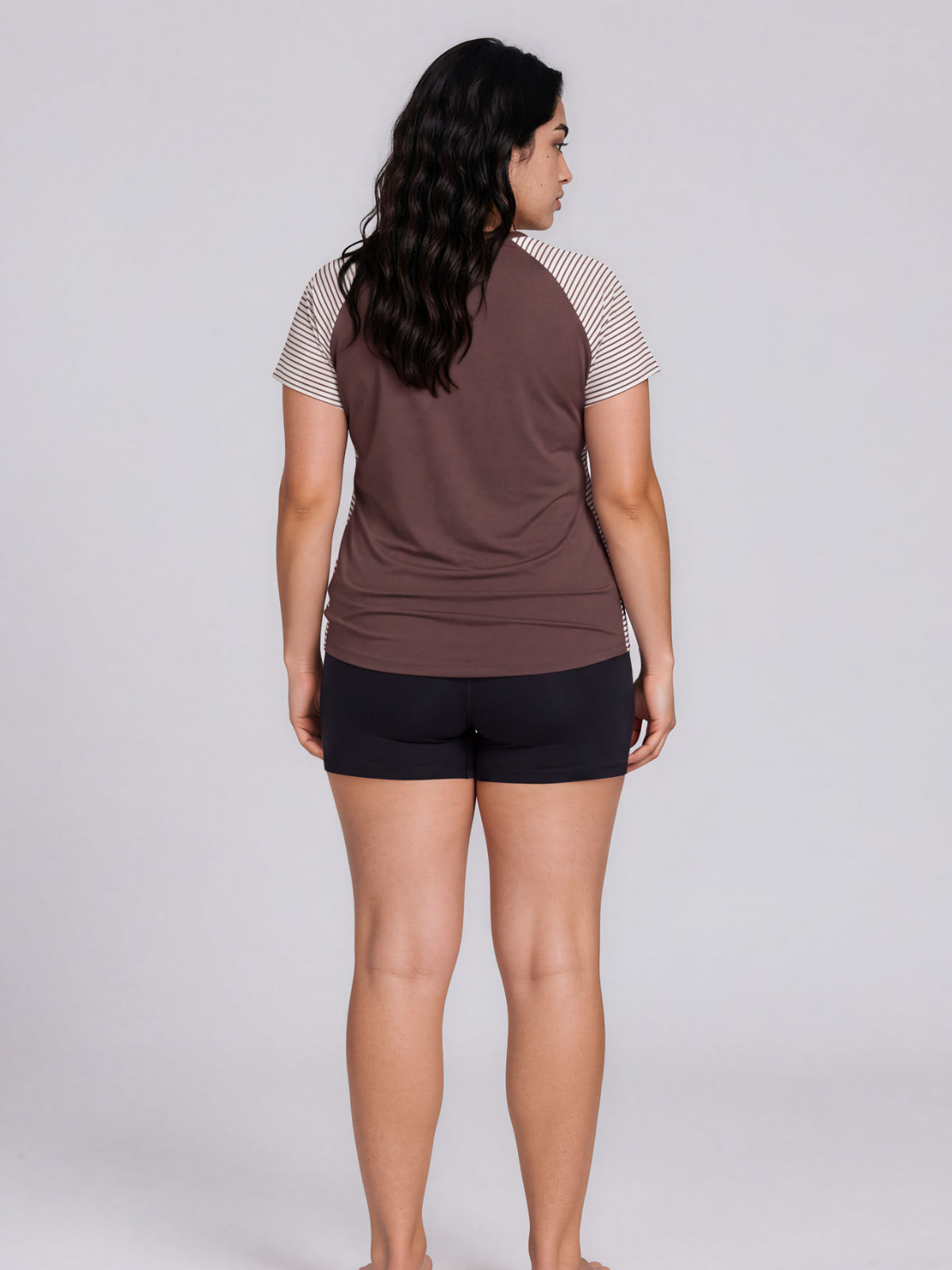 Loose Fit Adele Swim Top | Plus Size shown from the back on a model in a brown modest design with striped sleeves and a comfortable fit.