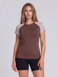 Loose Fit Adele Swim Top in brown with striped short sleeves modeled by a woman as supportive and comfortable swimwear designed for every body