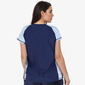 Woman wearing size-inclusive Loose Fit Adele Swim Top | Final Sale in navy and dusty blue with a comfortable fit, designed as modest, supportive swimwear for every body.