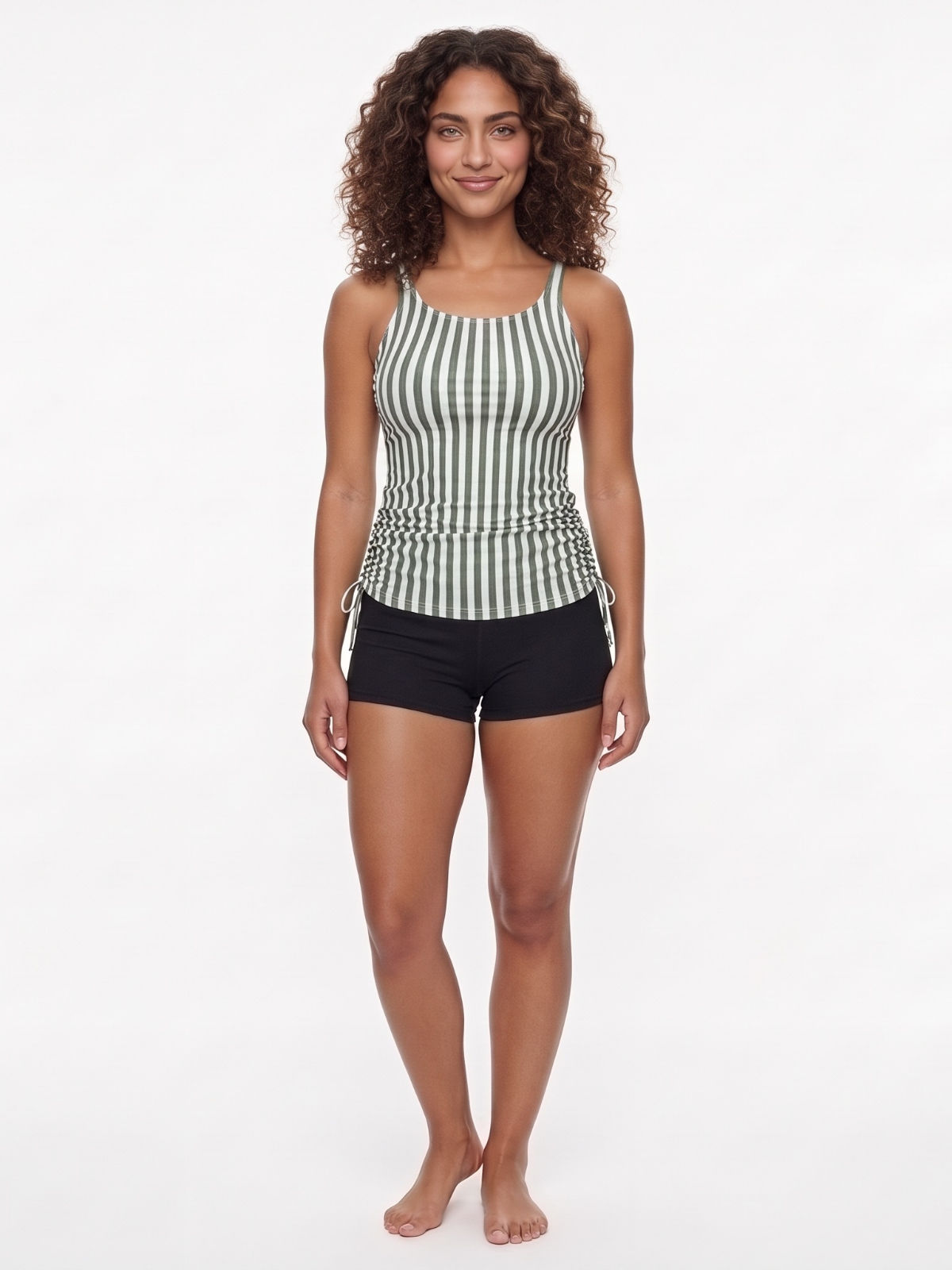 Maya Tankini Swim Top With Removable Cups in green and white stripes modeled with black swim shorts for supportive comfortable swimwear designed for every body