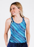 Woman wearing a blue striped tank top against a white background