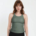Maya Tankini Swim Top With Built-in Bra in olive green modeled with black swim bottoms for supportive comfortable size-inclusive swimwear designed for every body
