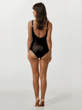 Woman wearing a black swimsuit on a white background