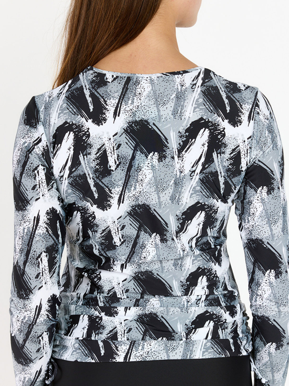 Nora Swim Top | Final Sale shown on a smiling woman in a modest long sleeve black and white print supportive comfortable size-inclusive swimwear for every body