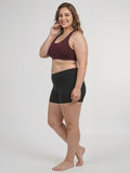 Racerback Swim Bra | Plus Size in burgundy paired with black swim shorts on a smiling model showing supportive modest swimwear with a comfortable fit for every body