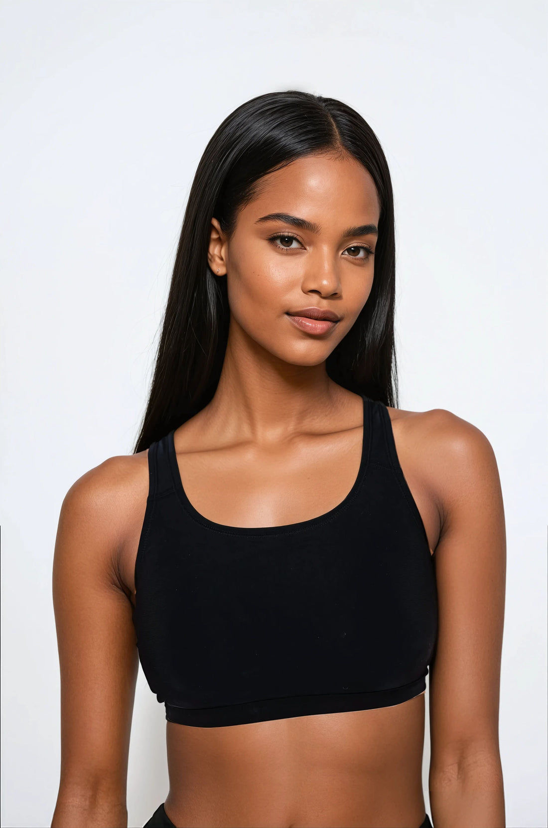 Woman wearing a blue floral bikini top on a white background